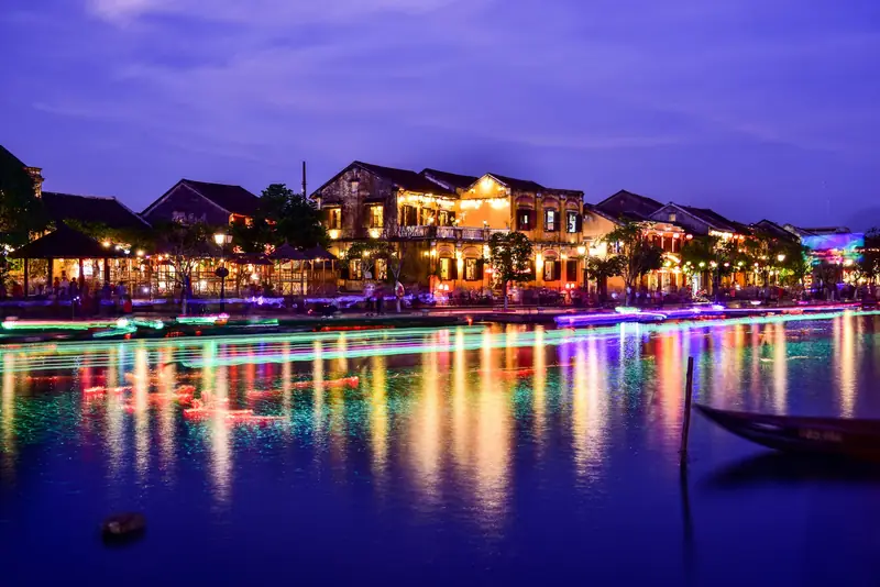 Hoi An's old town lit up along the river at blue hour